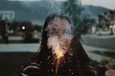 View of girl with sparkler