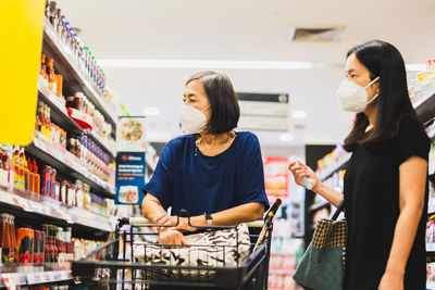 Young woman standing in store