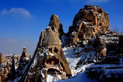 Rock formations with caves at cappadocia during winter