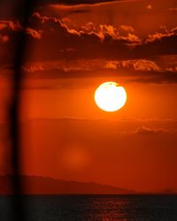 Scenic view of sea against orange sky