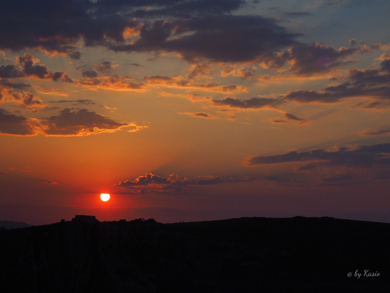 SUNSET OVER MOUNTAIN