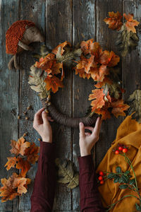 Midsection of woman holding christmas tree