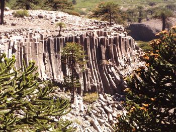 Scenic view of waterfall against mountain