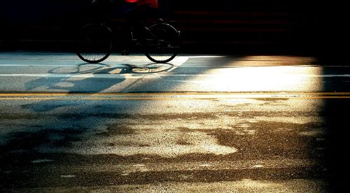 Low section of man cycling on bicycle