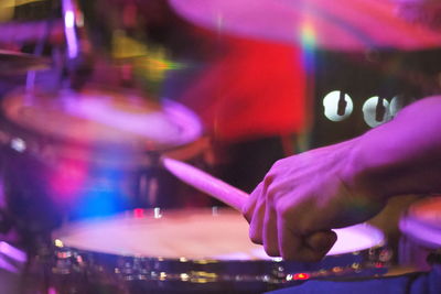 Cropped image of man playing drum