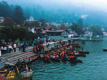 High angle view of people by boats in river