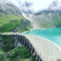 Scenic view of dam and mountains