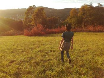 Rear view of man on field