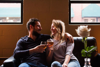 Young couple sitting at home