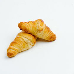 High angle view of bread on white background