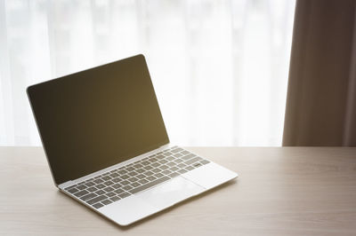 Close-up of laptop on table