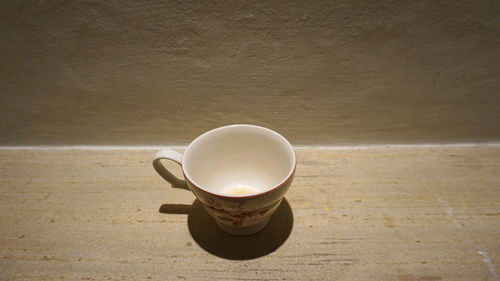 High angle view of coffee cup on table