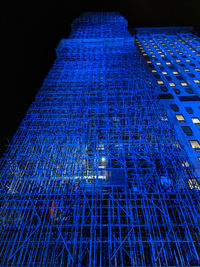 Low angle view of illuminated building at night