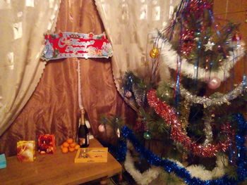 Close-up of christmas decorations hanging on tree