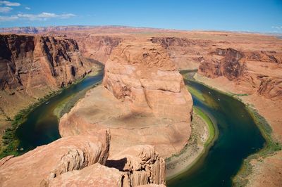 High angle shot of lake along rocky landscape