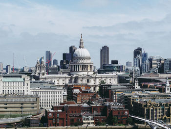 Buildings in city against sky