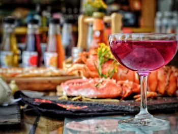 Close-up of wine in glass on table