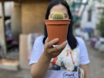 Close-up of woman holding coffee cup