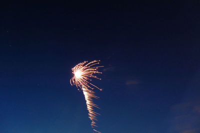 Low angle view of fireworks in sky
