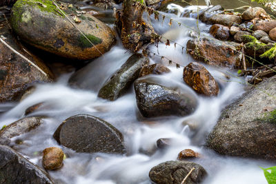 Close-up of water flowing through rocks