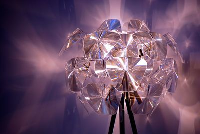 Low angle view of illuminated ferris wheel at night