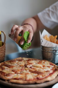 Midsection of woman preparing food