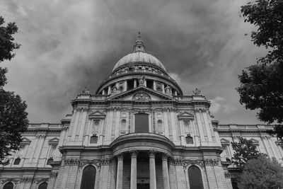 Low angle view of building against cloudy sky