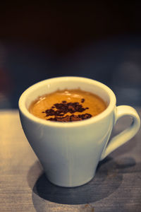 Close-up of coffee cup on table