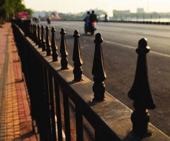 Close-up of railings by road