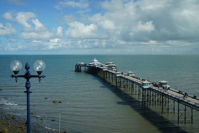 Pier on sea against sky