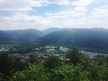 Scenic view of landscape and mountains against sky