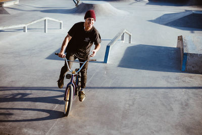 Man riding bicycle on street