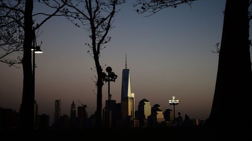 Silhouette of buildings against sky during sunset