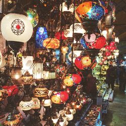 Multi colored lanterns hanging in store