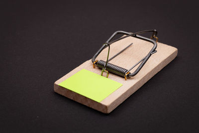 High angle view of container on table against black background