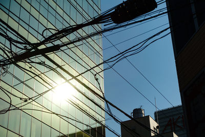 Low angle view of cables against sky