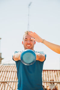 A couple exercising on their rooftop