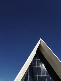 Low angle view of building against blue sky