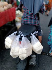 Rear view of woman standing in market