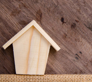 Close-up of wooden model house on table