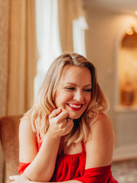 Portrait of smiling young woman at home