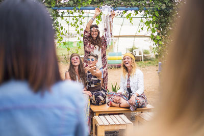 Cheerful hippie women enjoying outdoors