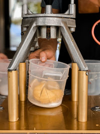 Person working in container making lemonade