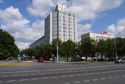 City street against cloudy sky