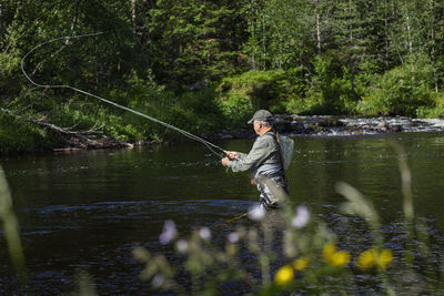 Man fishing in river