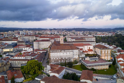 Coimbra city drone view with historic buildings at sunset, in portugal