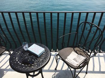 Chairs and table by sea