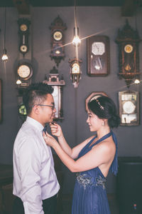 Side view of two women standing outdoors