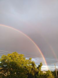 Low angle view of rainbow against sky