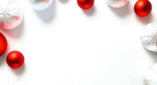 Close-up of christmas decorations on white background